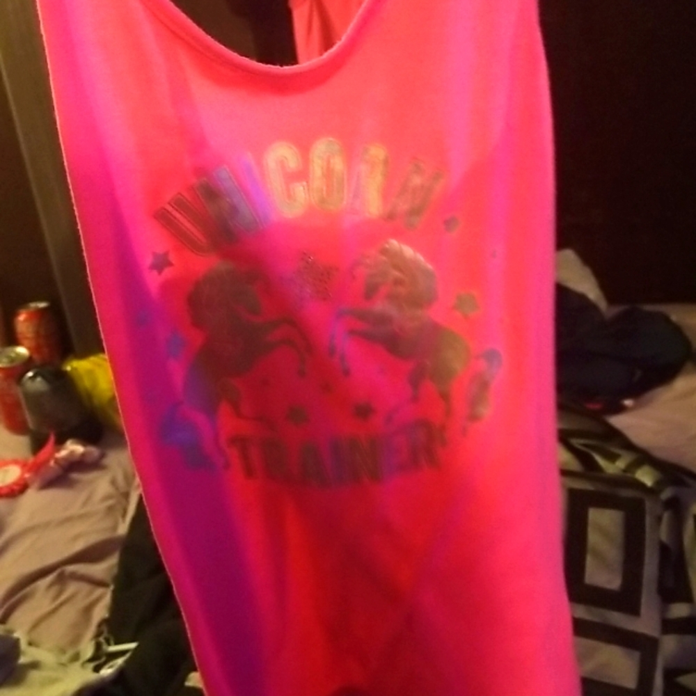 A bright pink unicorn trainer tank top